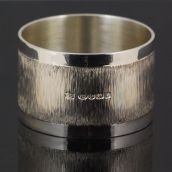 Silver napkin ring with bark effect decoration